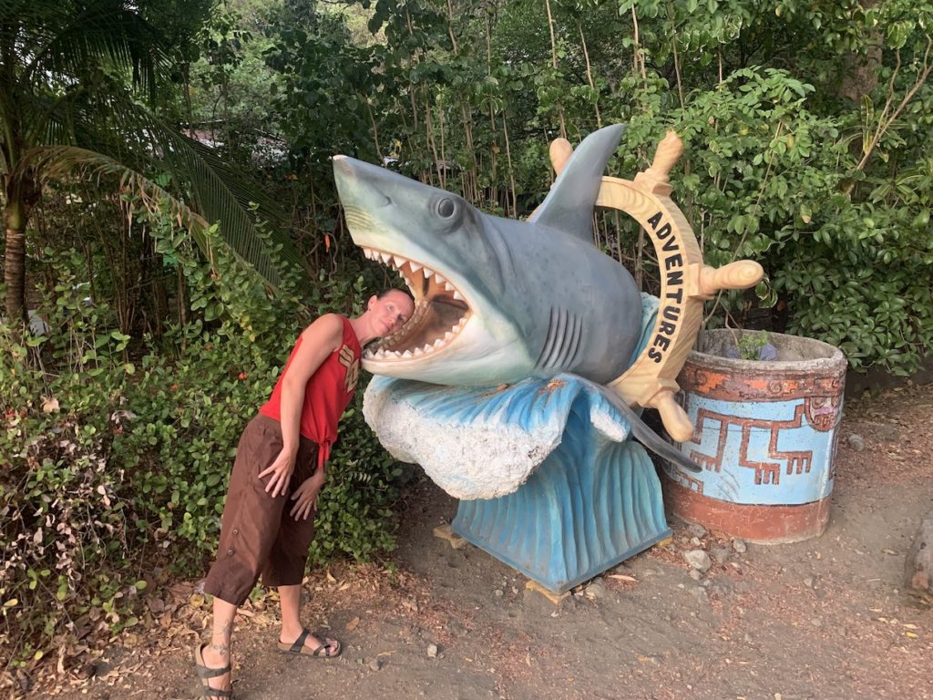 Mrs. ItchyFeet with head in shark statue