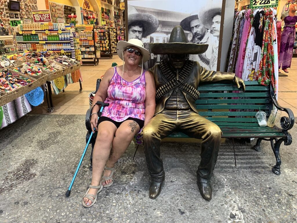 Mother-in-law sitting next to statue of man in sombrero