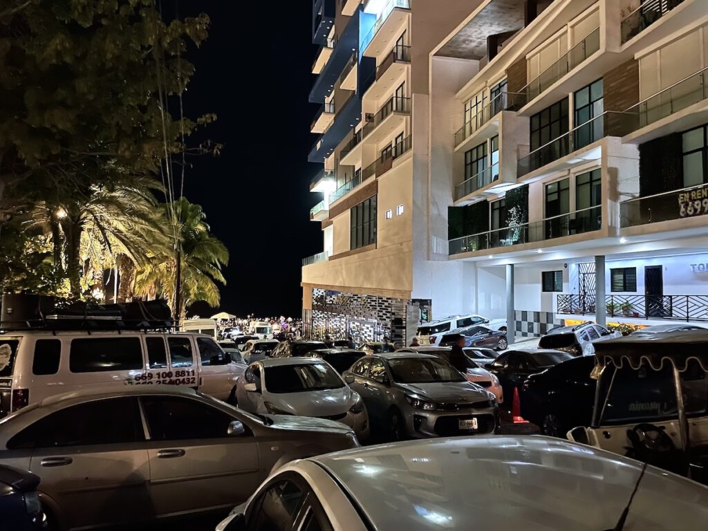 Cars parked in street for parade