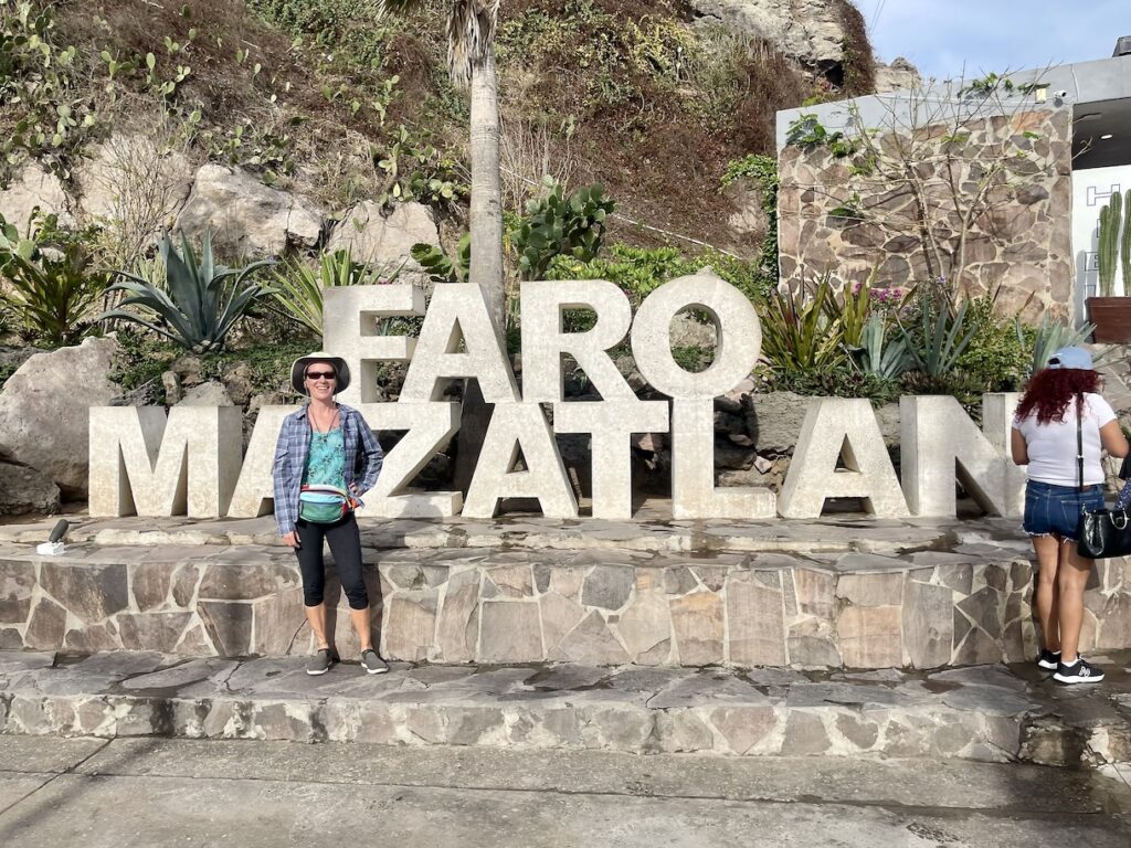 Mrs. ItchyFeet in front of Faro letters
