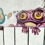 Street art of frog dreaming of food