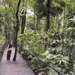 Mrs. ItchyFeet on botanical garden boardwalk