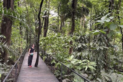 Mrs. ItchyFeet on botanical garden boardwalk