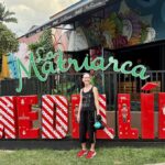 Mrs. ItchyFeet in front of Medellín letters