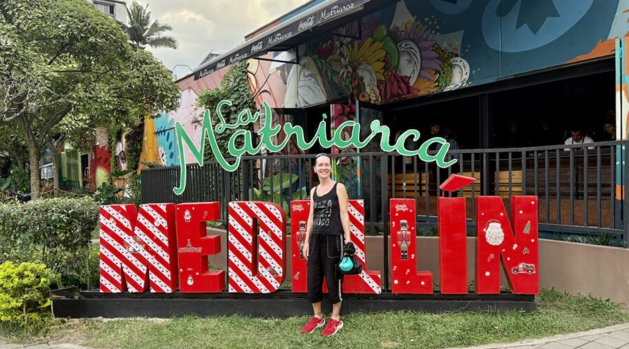 Mrs. ItchyFeet in front of Medellín letters