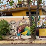 Mrs. ItchyFeet in front of Puerto Escondido street art