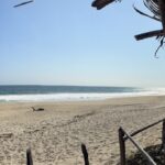 Hiker on beach as seen from restaurant