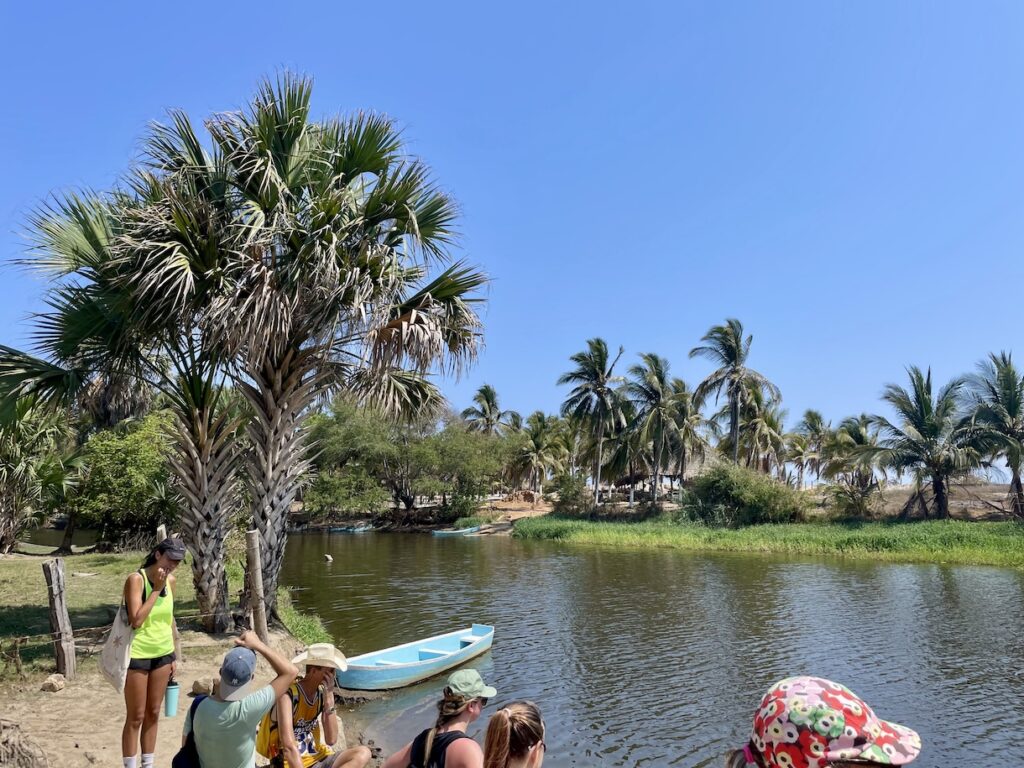 Hikers waiting by lagoon
