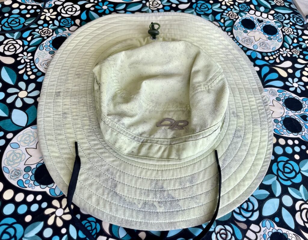 Moldy green hat on table