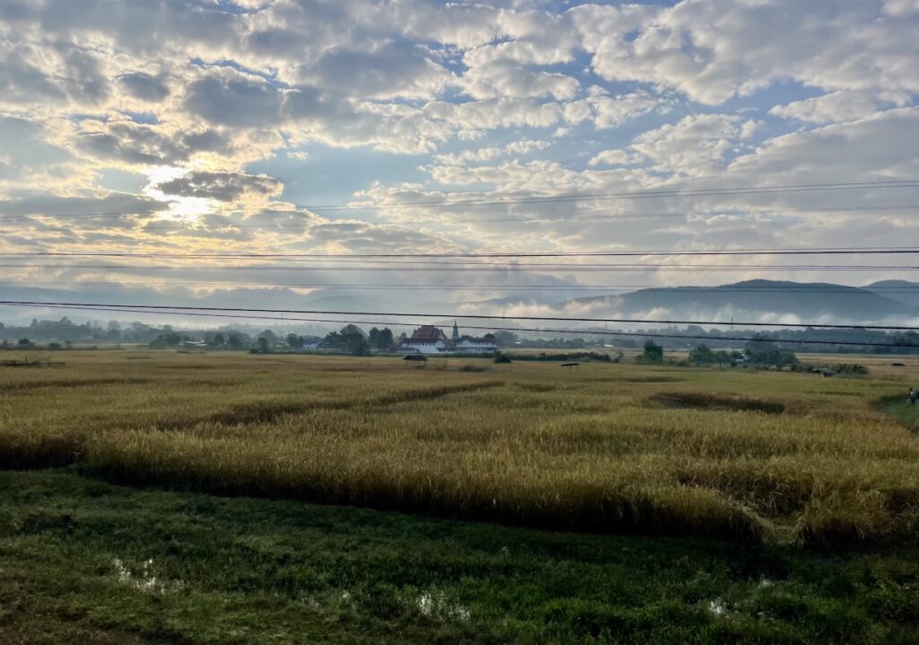 Sunrise with temple in the mist