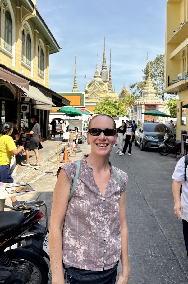 Mrs. ItchyFeet in front of Buddhist Temple