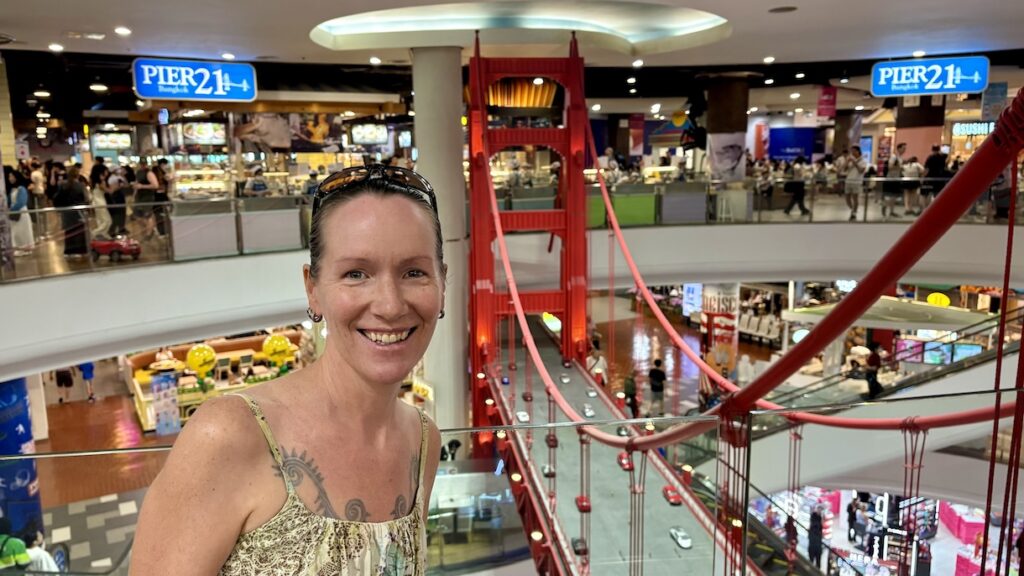 Mrs. ItchyFeet in front of San Francisco Bridge in Terminal 21 Mall