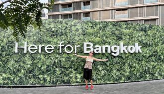 Mrs. ItchyFeet in front of Bangkok letters