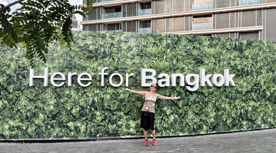 Mrs. ItchyFeet in front of Bangkok letters