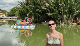 Mrs. ItchyFeet with Hội An letters in river