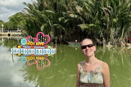 Mrs. ItchyFeet with Hội An letters in river