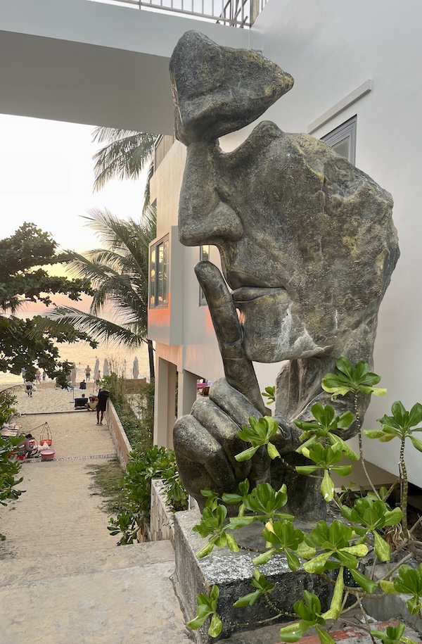 Sunset and human statue near Sunset Beach Bar