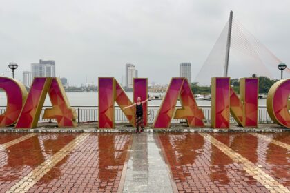 Mrs. ItchyFeet and Đà Nẵng letters in the rain