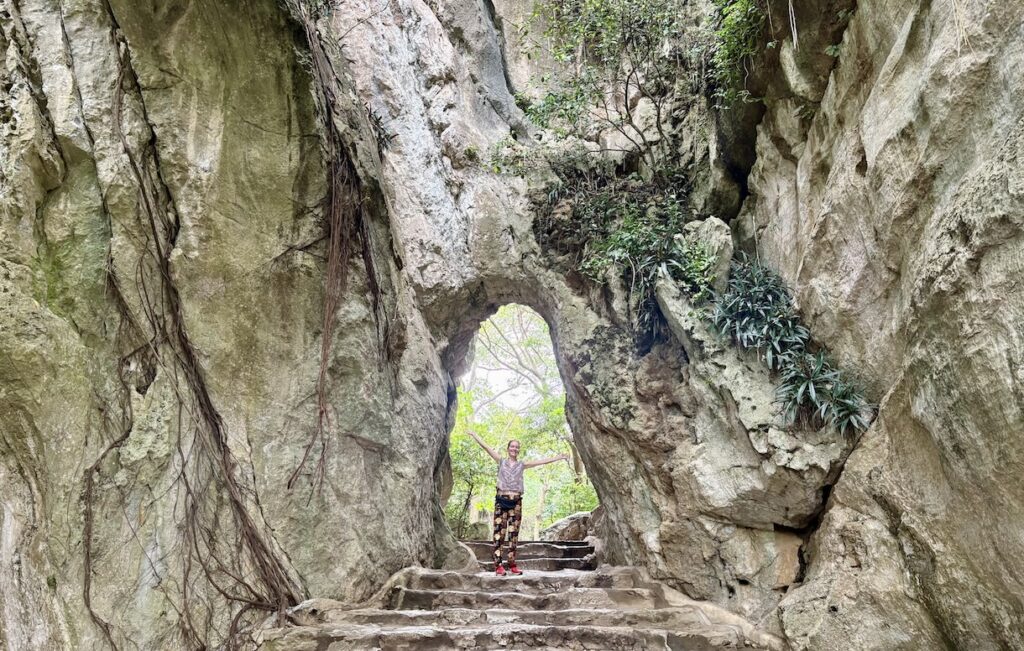 Mrs. ItchyFeet in rock doorway