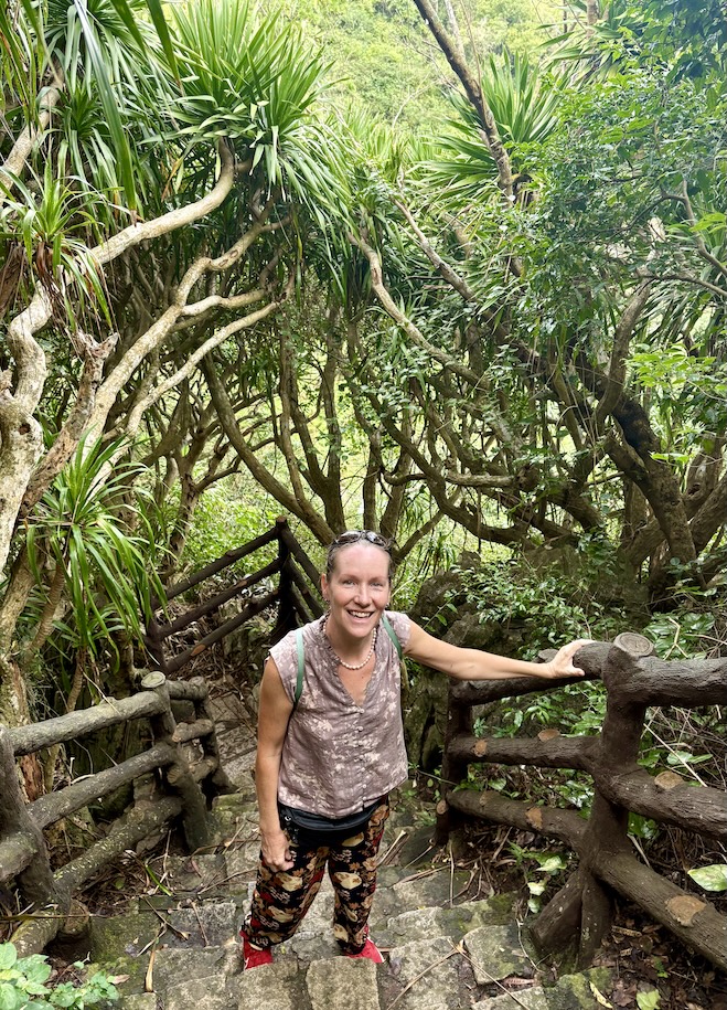Mrs. ItchyFeet climbing stairs to overlook