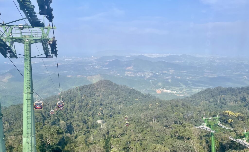 Ride up gondola with Đà Nẵng in distance