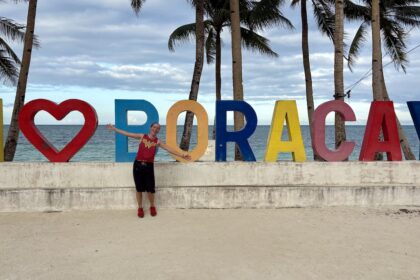 Mrs. ItchyFeet in front of Boracay letters
