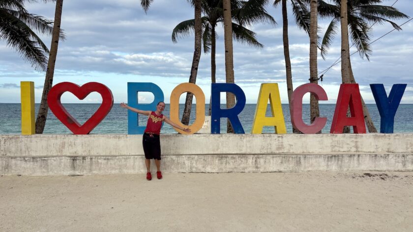 Mrs. ItchyFeet in front of Boracay letters