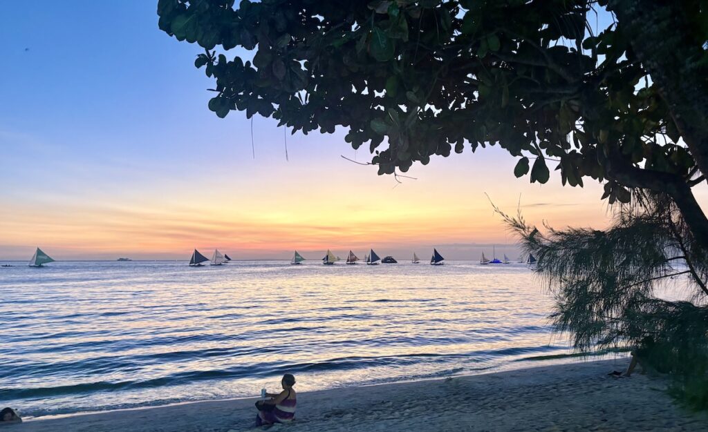 Sunset and sailboats at White Sand Beach