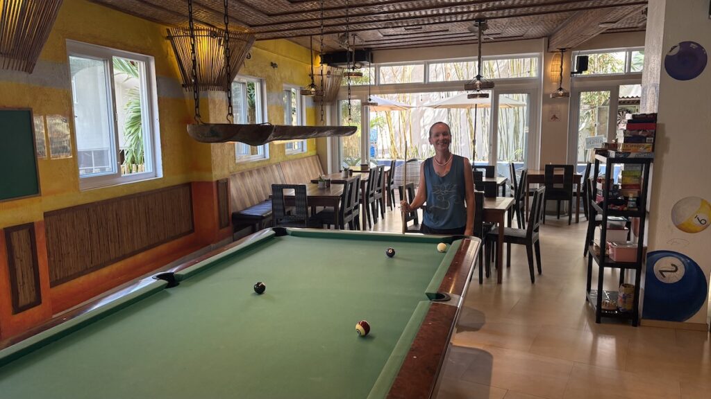 Mrs. ItchyFeet playing pool in hotel lounge