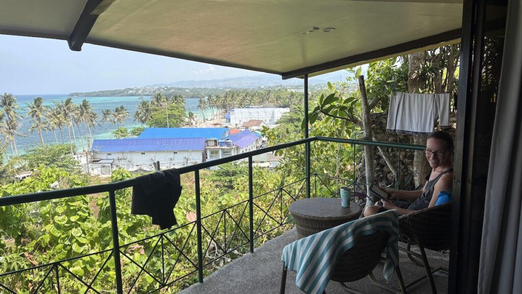 Mrs. ItchyFeet on deck with a view of Bulabog Beach